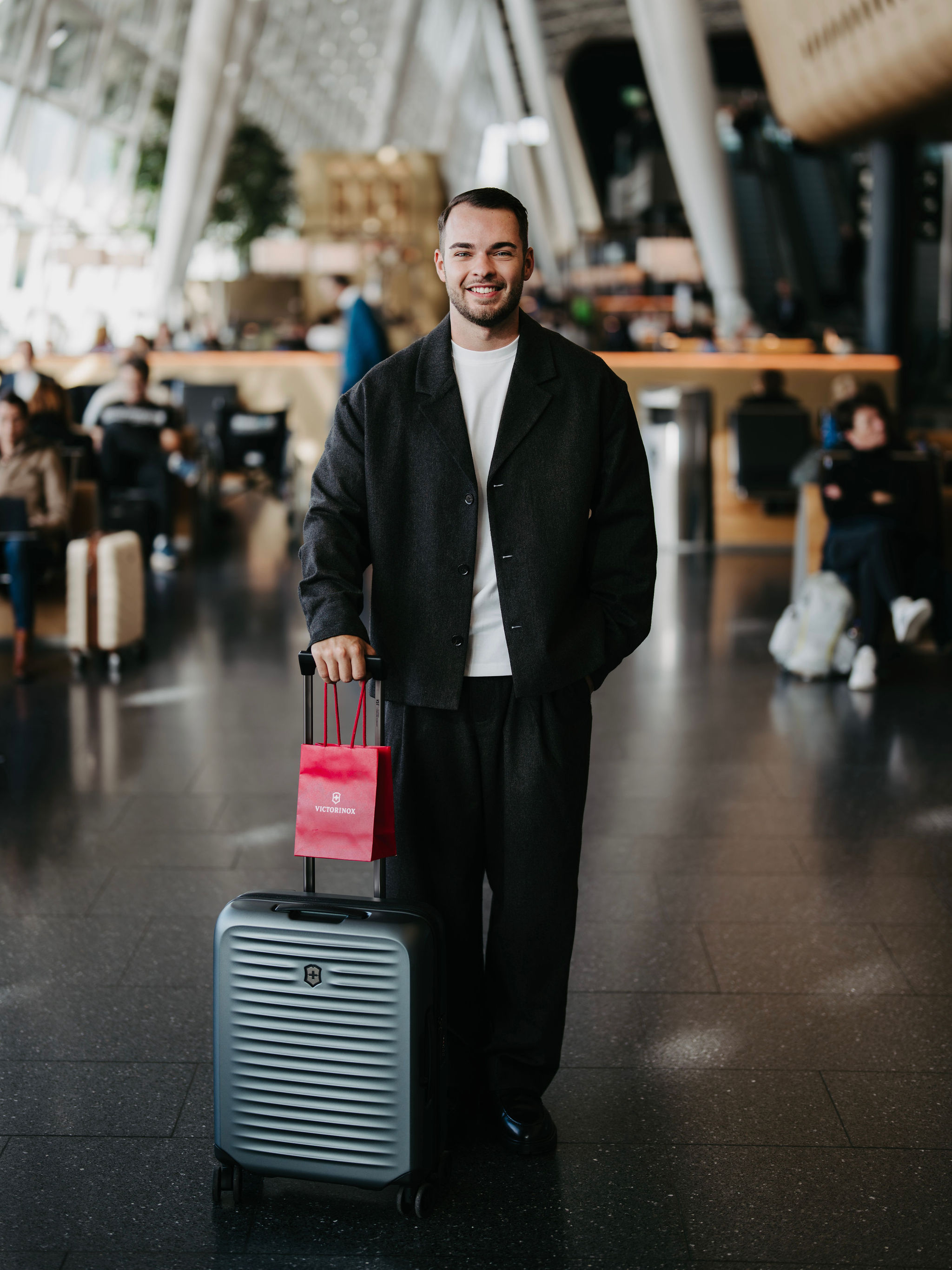 Ben with Victorinox luggage at the airport